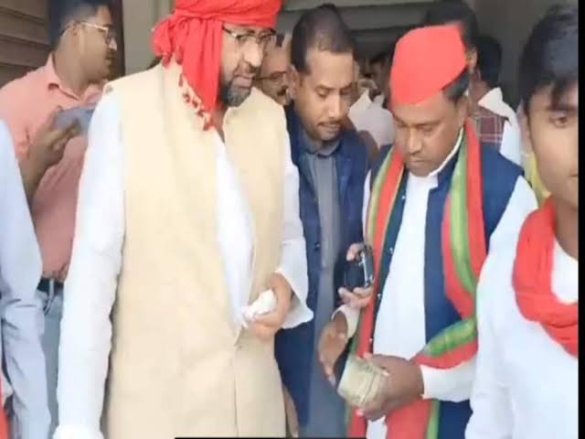 images 9 - प्रत्याशी का नोट की गड्डी देने का वीडियो, एसडीएम ने भीम निषाद और विधायक को दी नोटिस।